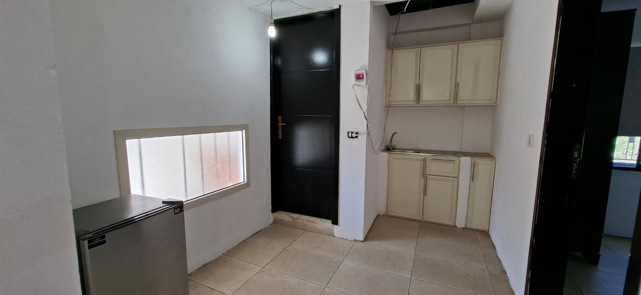 Chalet kitchenette with mini fridge and cabinets