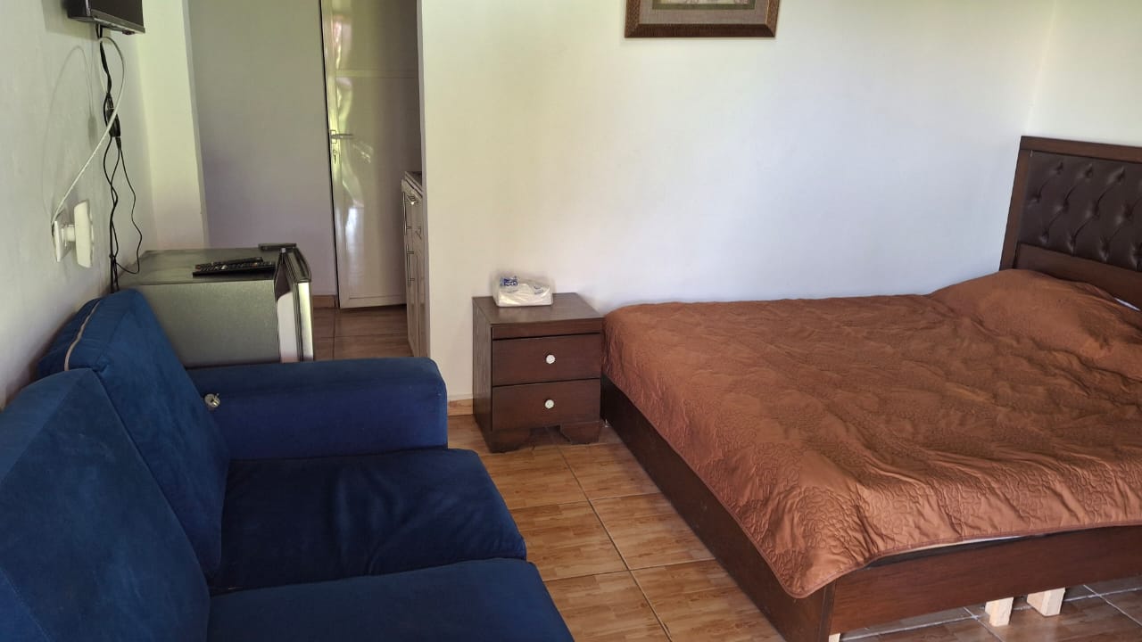Chalet room with sofa and double bed